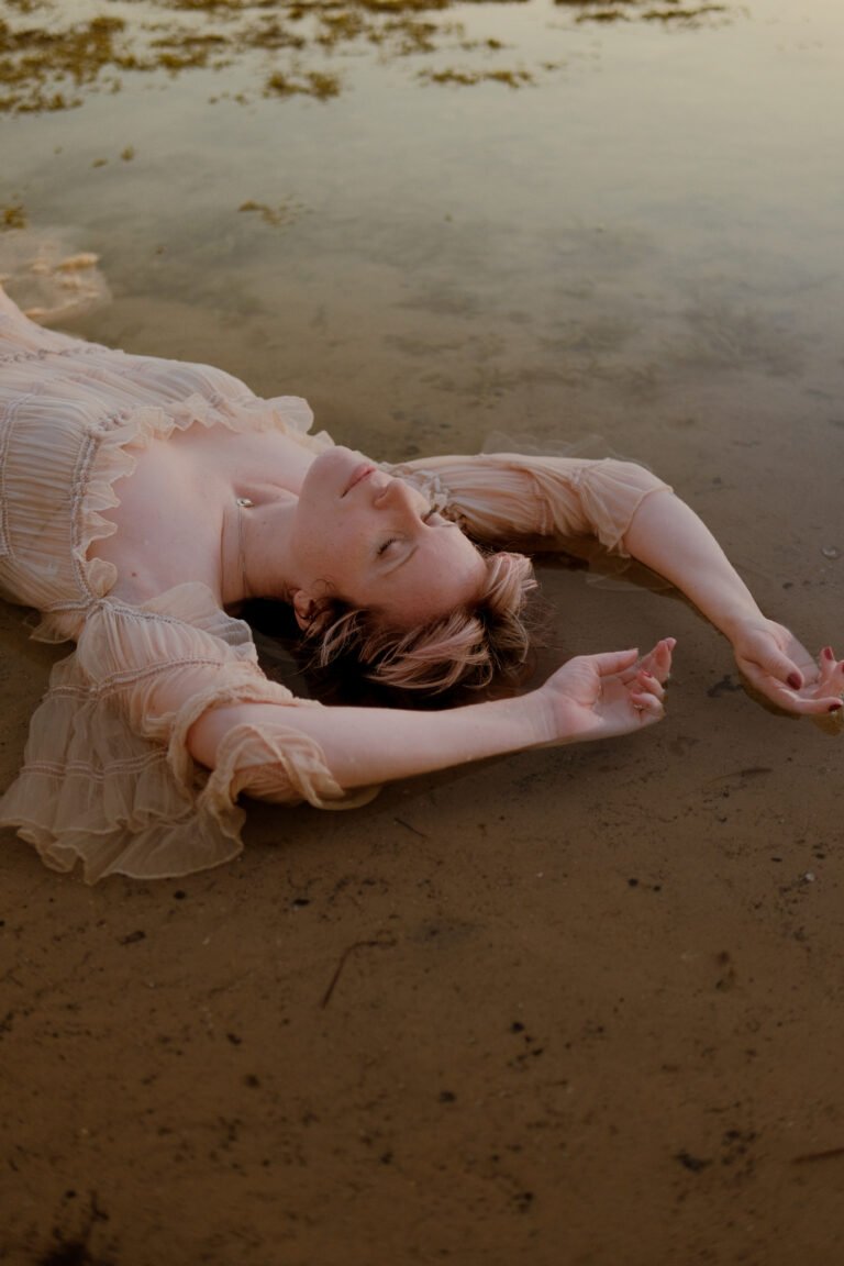 Whimsical photoshoot woman in water